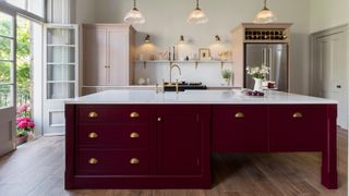 a pink and burgundy kitchen