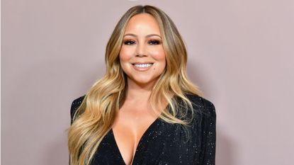 mariah carey on a gray background