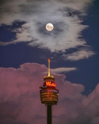 The full Strawberry Moon of June 2024 shines over Sydney Tower Eye in Sydney, Australia on June 21, 2024.