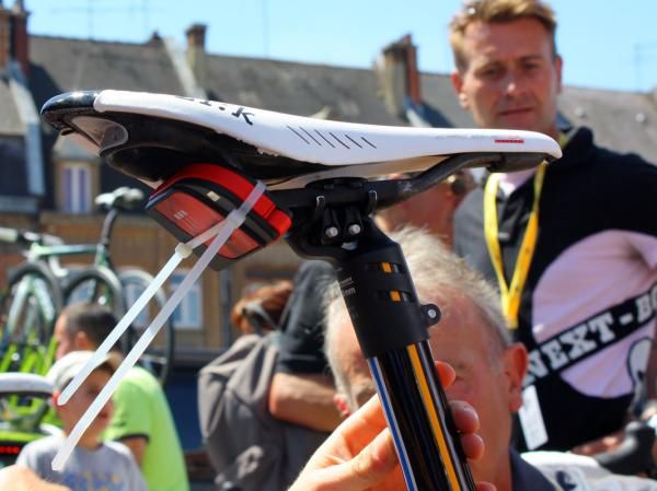 Francaise des Jeux mechanics were trying to figure out a way to secure attach a telemetry transmitter prior to the start of the stage.