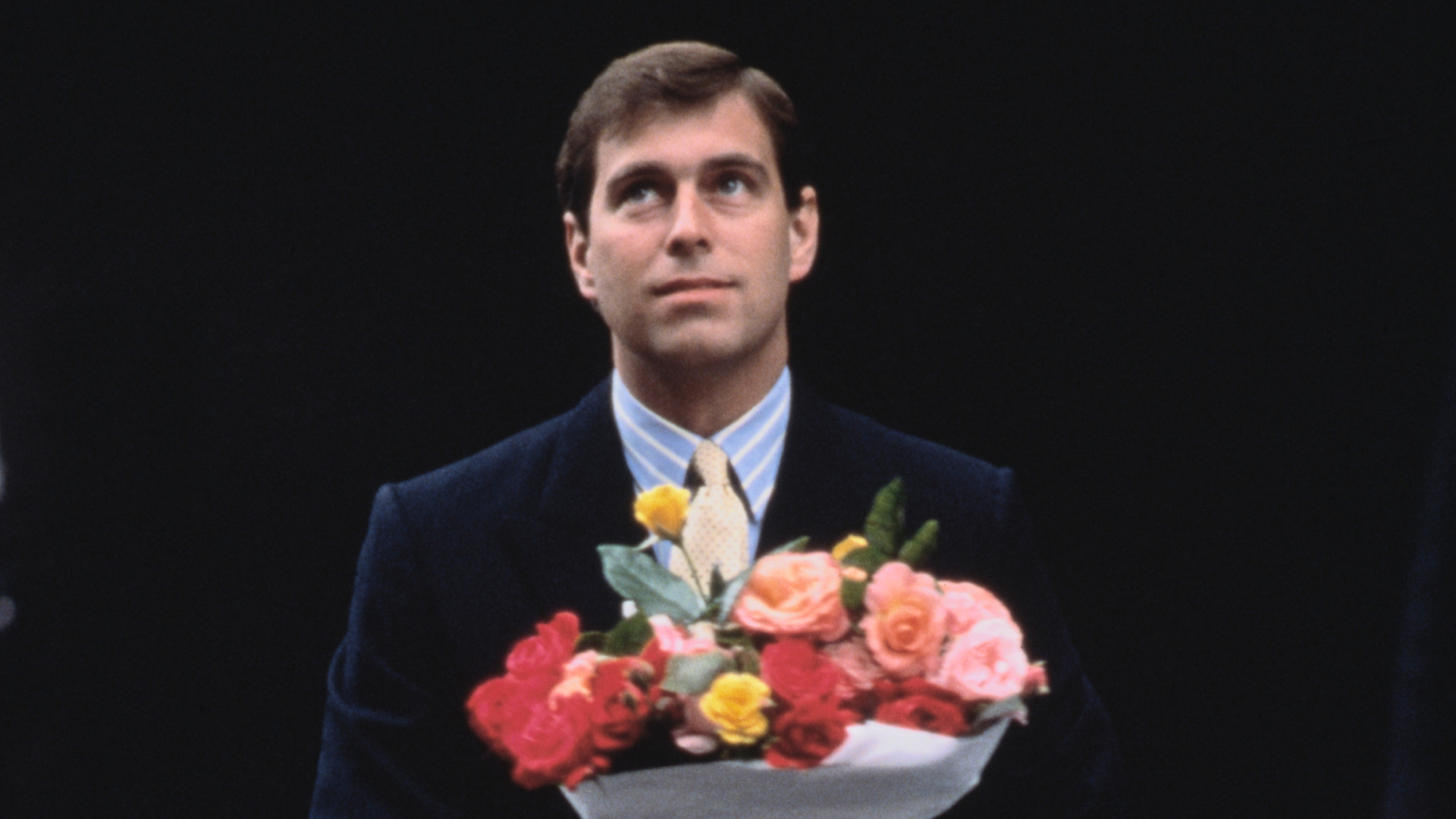 Prince Andrew arrives with flowers after the birth of his first daughter, Princess Beatrice, London, 9th August 1988