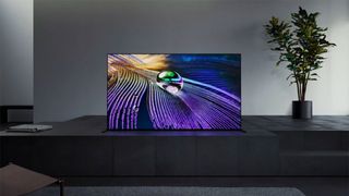 The Sony A90J OLED TV in a modern living room setting. 