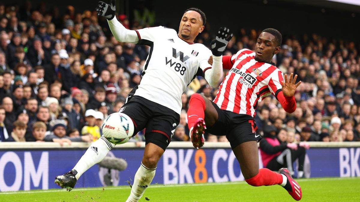 Kenny Tete of Fulham is challenged by Abdoullah Ba of Sunderland during the Emirates FA Cup 