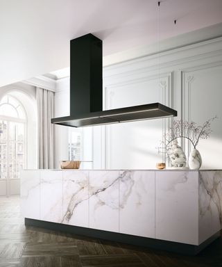 Modern white kitchen with sleek handleless design and black extractor