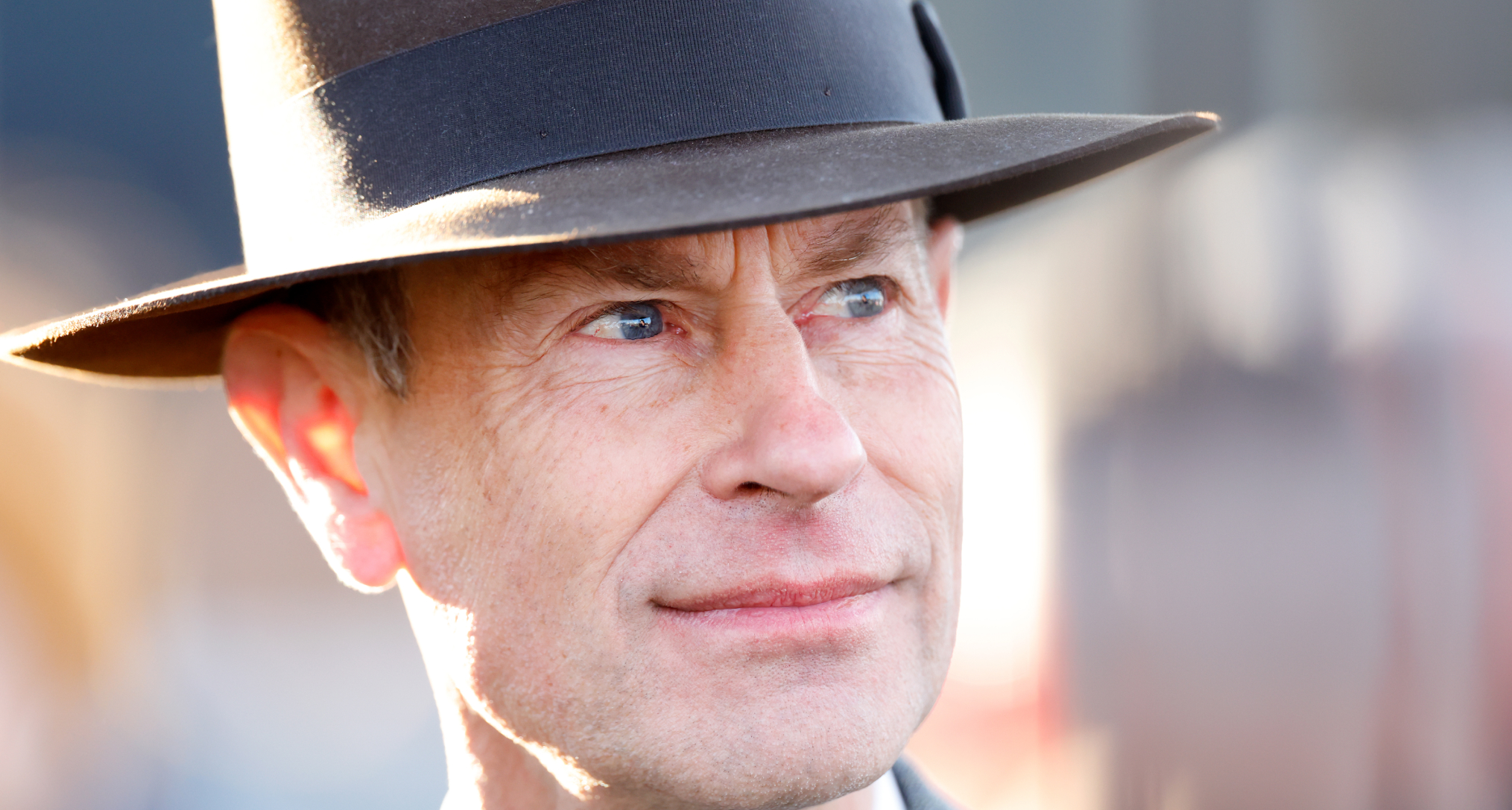 A headshot of Prince Edward wearing a gray hat