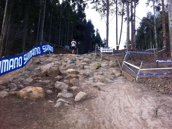 A person checks out the Rapid Rocks section of the cross country course on the day before riding the course is allowed.