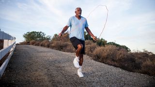 Man using jump rope to workout