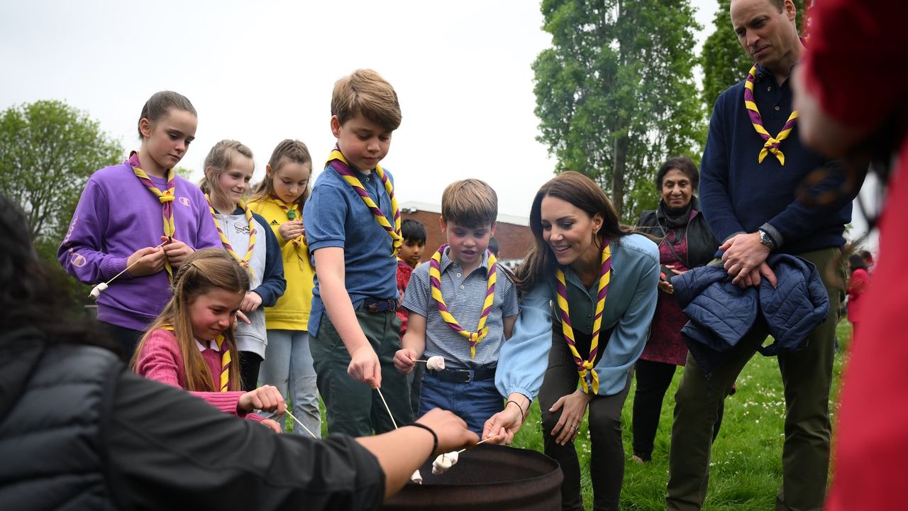 The Wales family roasting marshmallows with Scouts