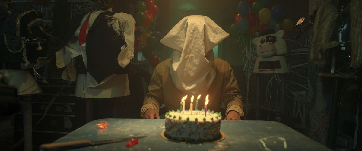 A person with a hood over their face in first-look image for THEM: The Scare