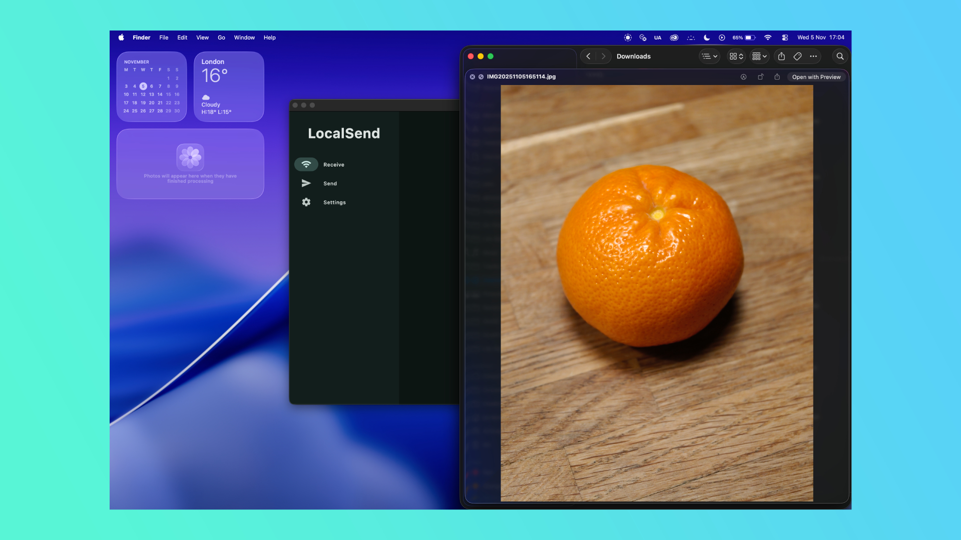 A photo of an orange open on a MacBook Pro