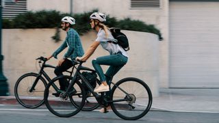 man and woman on Specialized ebikes