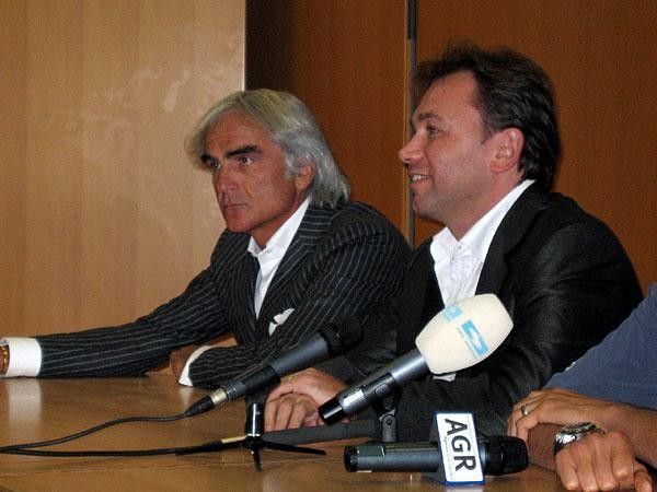 Basso is focused on racing while his lawyer, Massimo Martelli (left),