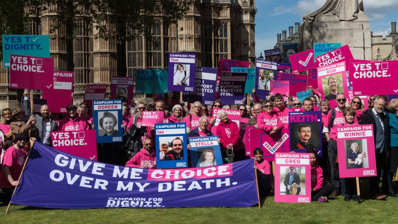 Campaigners from Dignity in Dying organisation take part in a rally outside Houses of Parliament in support of assisted dying, April 2024