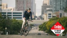 Male cyclist riding an electric bike in a city
