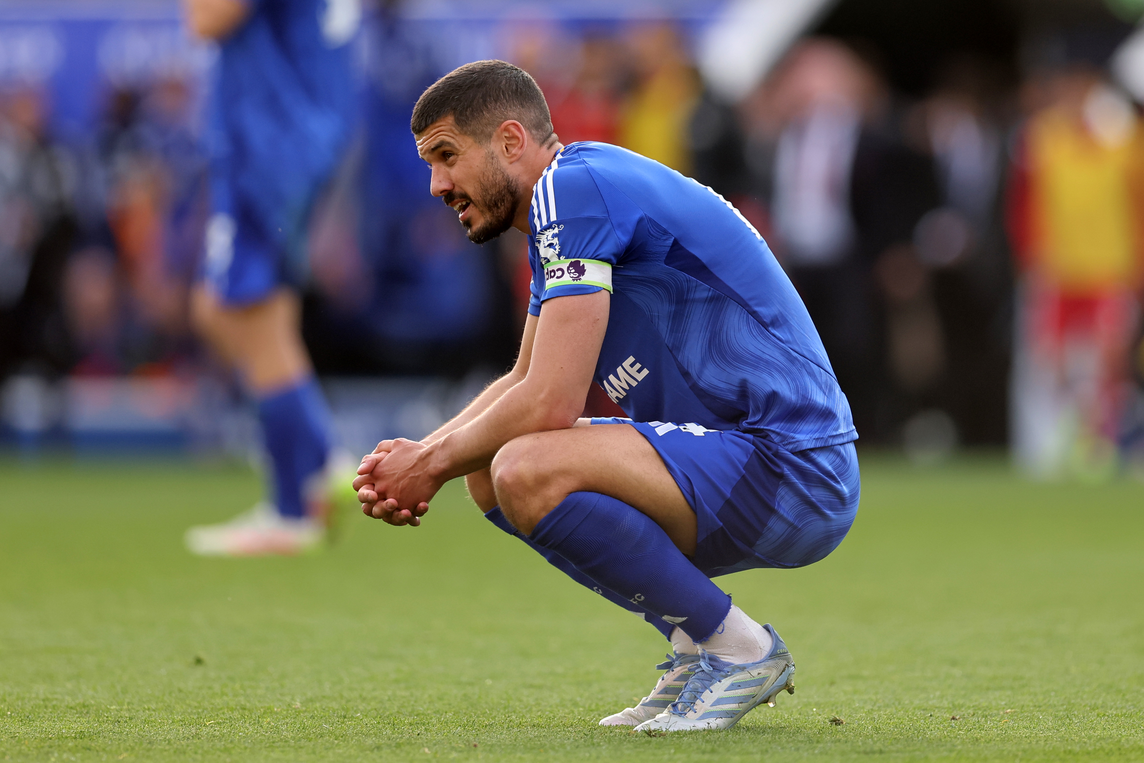 Leicester City defender Conor Coady looks dejected following his side's recent defeat against Liverpool