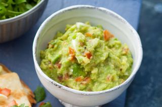 Making a big bowl of avocado guacamole Stock Photo - Alamy