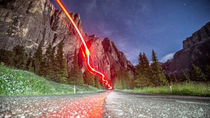 Best bike rear light: Pictured here, a long exposure shot of a bike rear light in a mountainous area