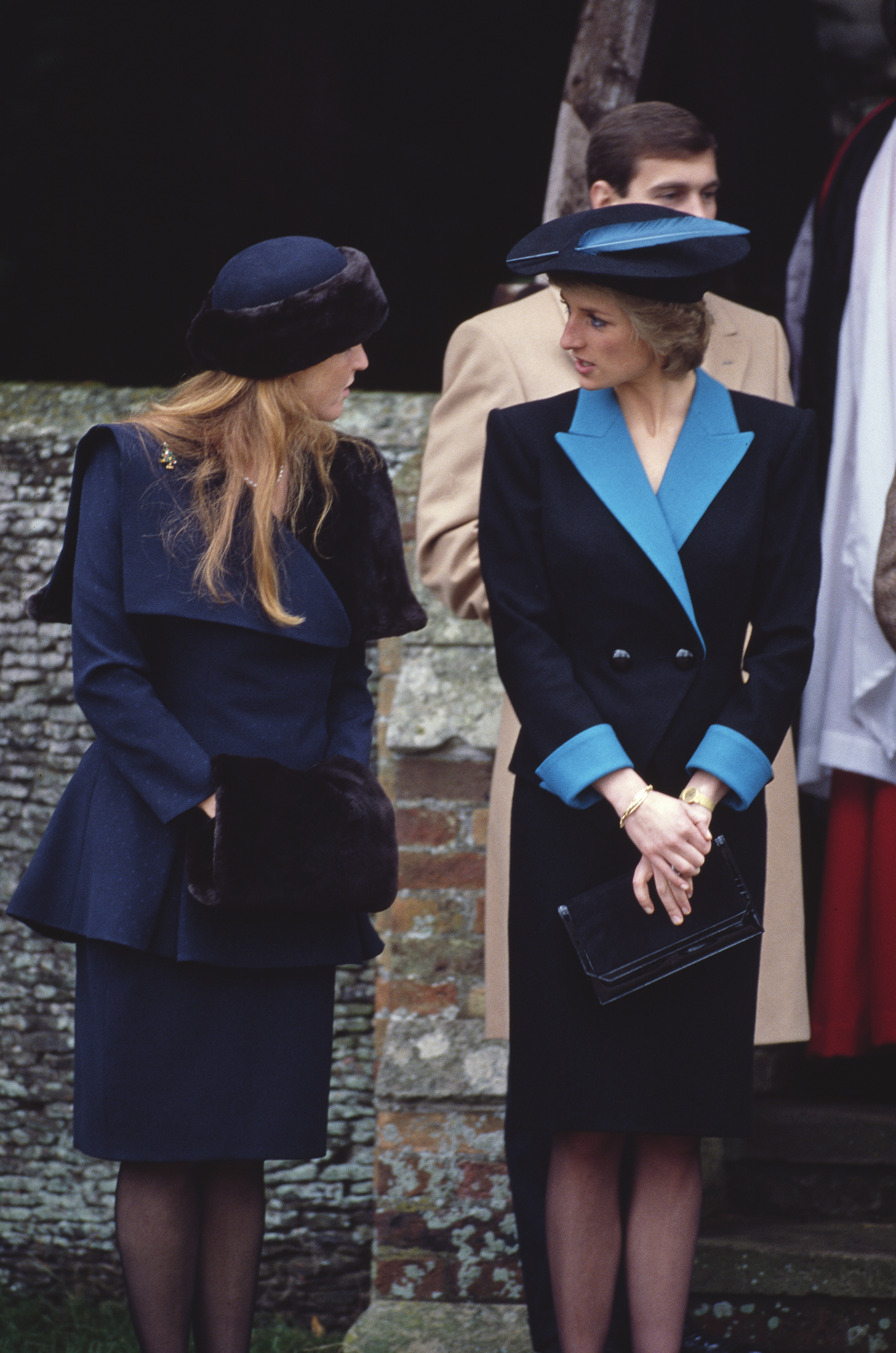Sarah Ferguson talking to Princess Diana outside church in blue skirt suits