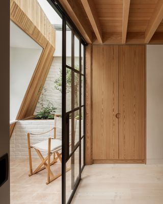 Timber terrace in the roof at Danish mews house
