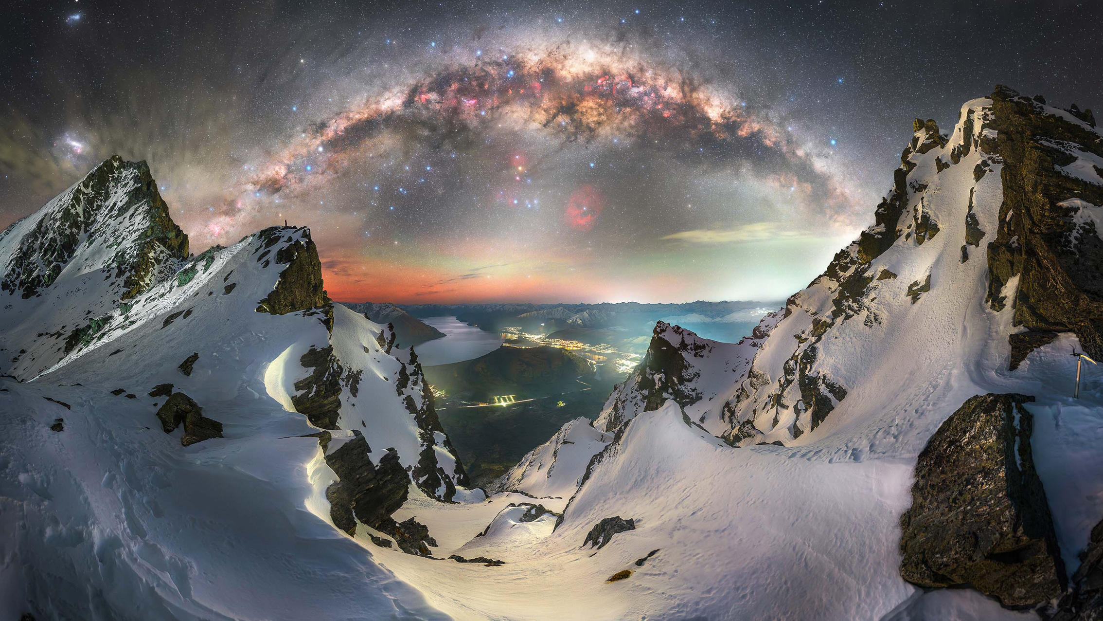 A breathtaking view of the Milky Way galaxy illuminating a mountain range under a clear night sky