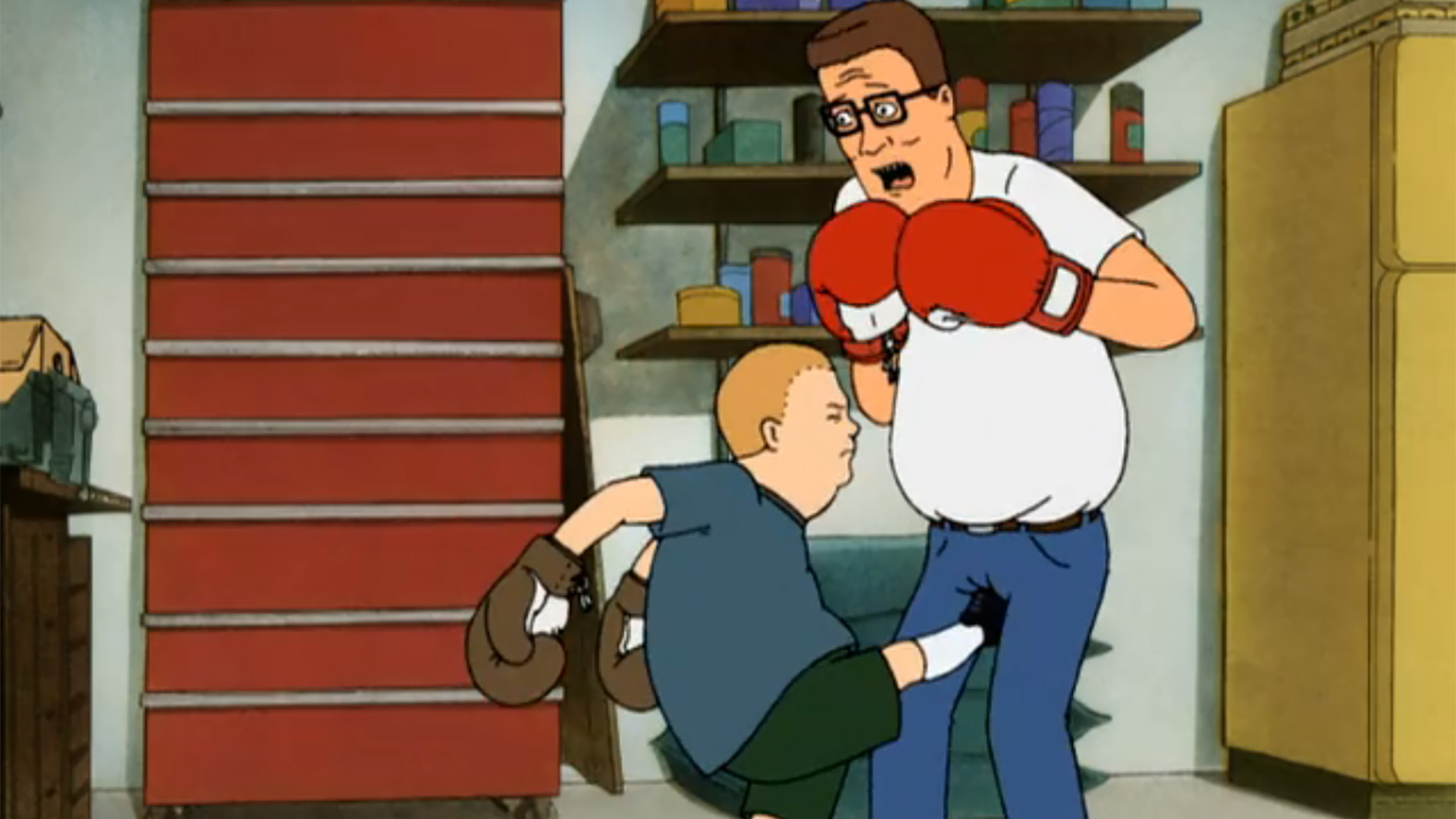 Bobby (Pamela Adlon) kicks Hank Hill (Mike Judge) in the groin in King of the Hill