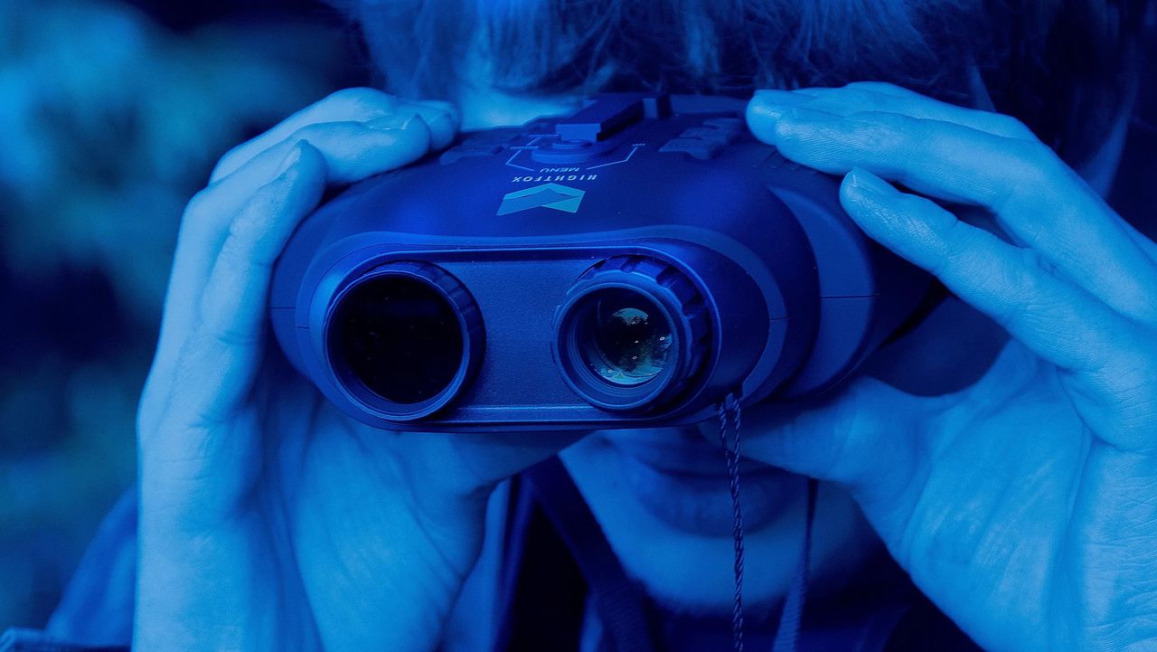 Person holding night vision goggles