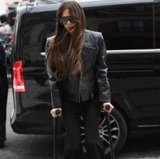 Victoria Beckham on crutches at Paris Fashion Week March 2024