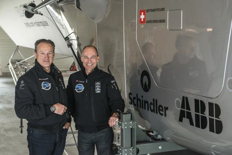 Andre Borschberg &amp; Bertrand Piccard Pose with Solar Impulse 2 Plane