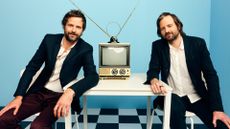 Ross Duffer and Matt Duffer, creators and producers of Stranger Things in a room with a CRT TV