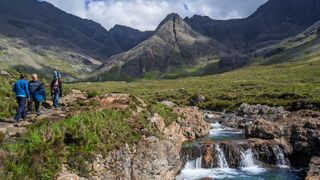 Hikers at Fairy Pools, Isle of Skye