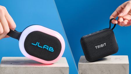 JLab Pop Party photographed on a blue background next to a Tribit PocketGo photographed ona. blue background.