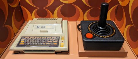 Atari 400 Mini review; a retro console on a retro themed background