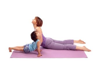 Mother and child practicing yoga