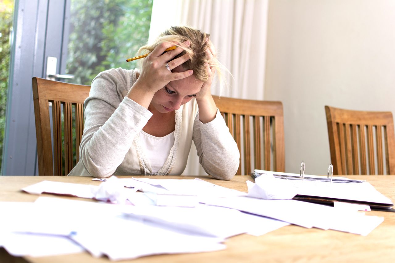 A woman paying bills.