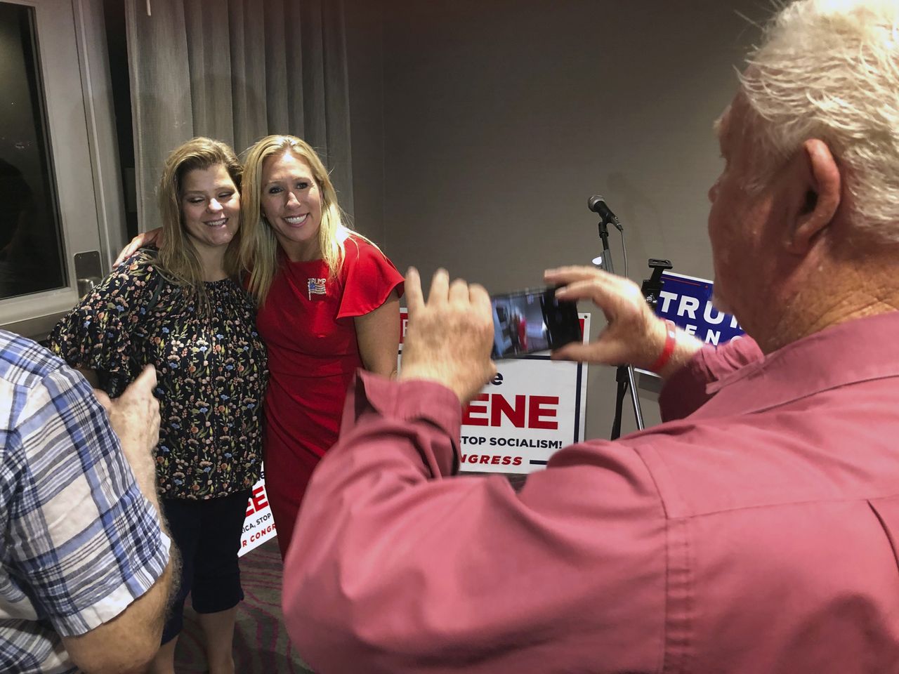 Marjorie Taylor Greene with a supporter.