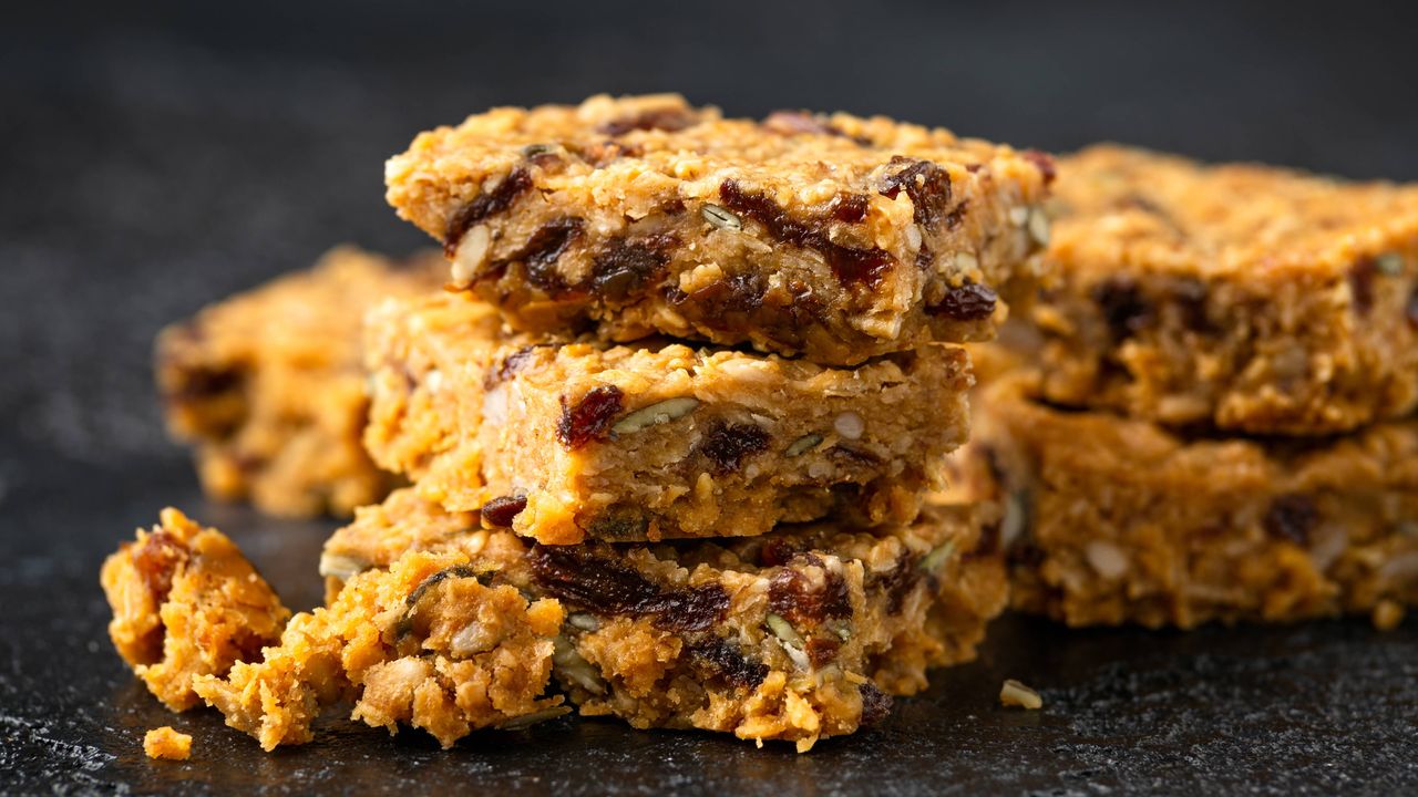 Raisin flapjacks stacked on a board