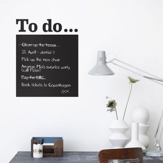 Blackboard To Do List Wall Sticker on a white wall behind a desk with white table lamp
