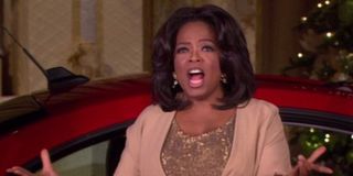 Oprah Winfrey giving out her favorite things on her talk show
