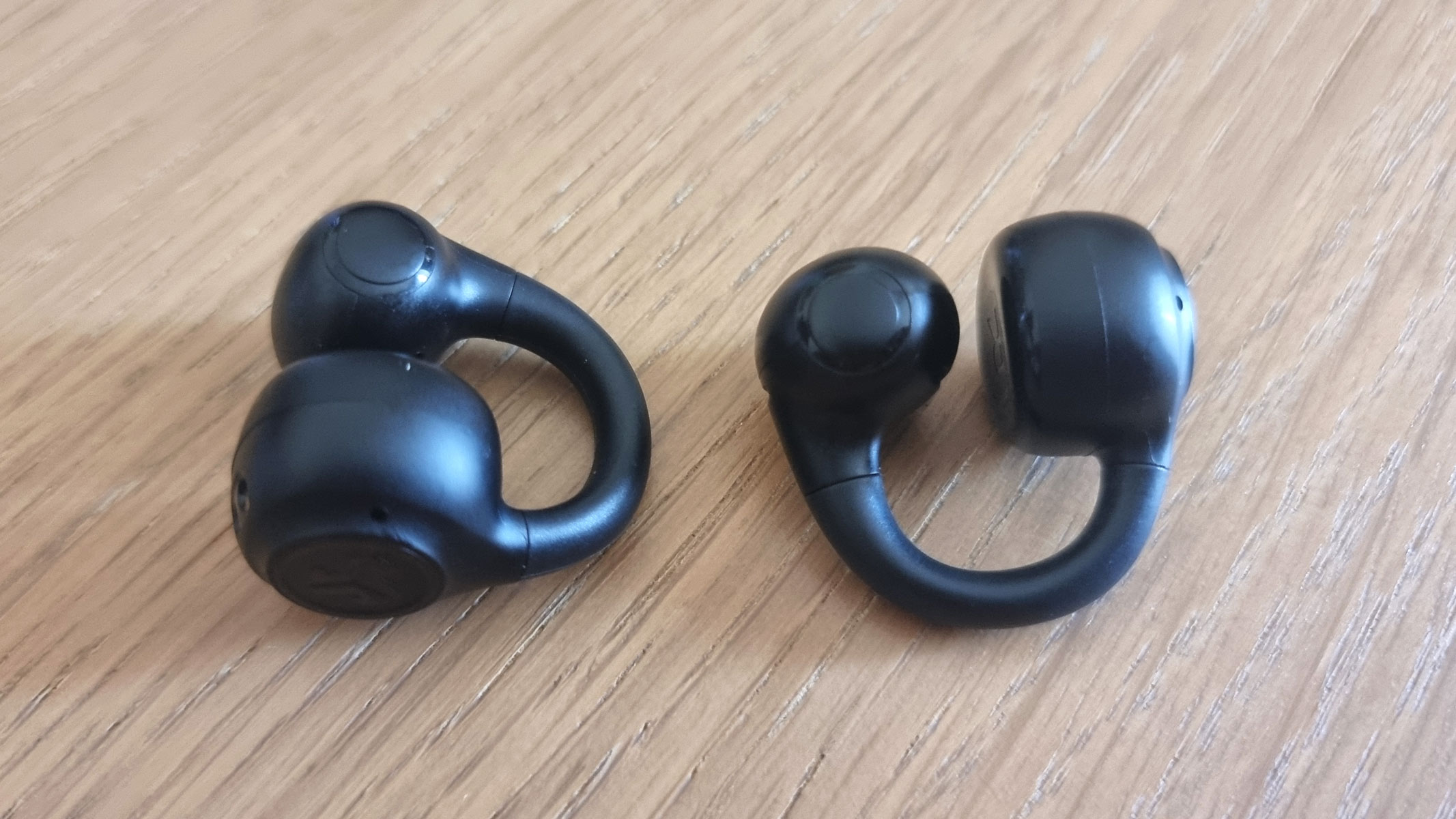 JLab Flex Open Earbuds out of the carrying case