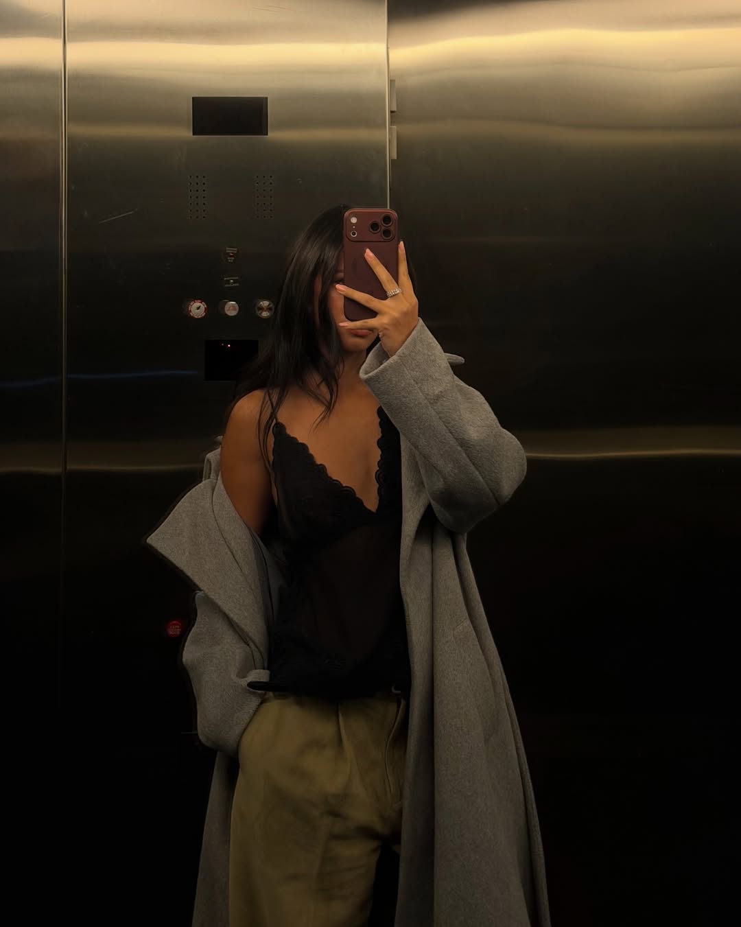 A woman wearing a fancy black tank and loose pants, part of the Spring Basics Outfit 2026.