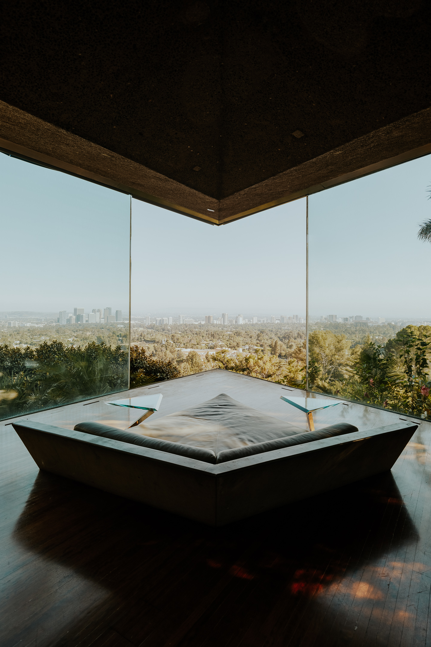 Sheats-Goldstein Residence in LA with its concrete sloped roof, pool and green open grounds