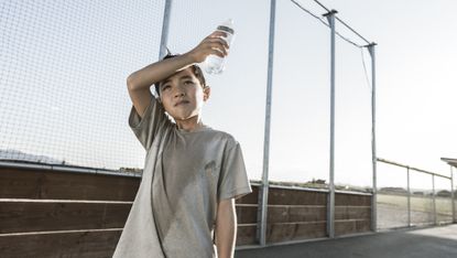 sweaty boy with water bottle