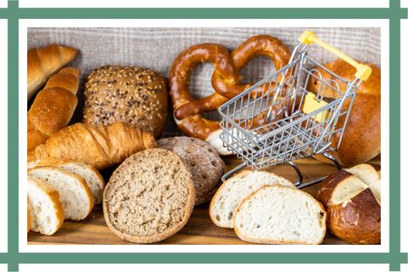 Buns, bread rolls and baked goods with a mini shopping trolley