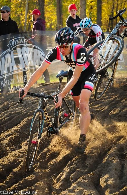 Jeremy Powers (Rapha Focus) having to run his bike in the sand