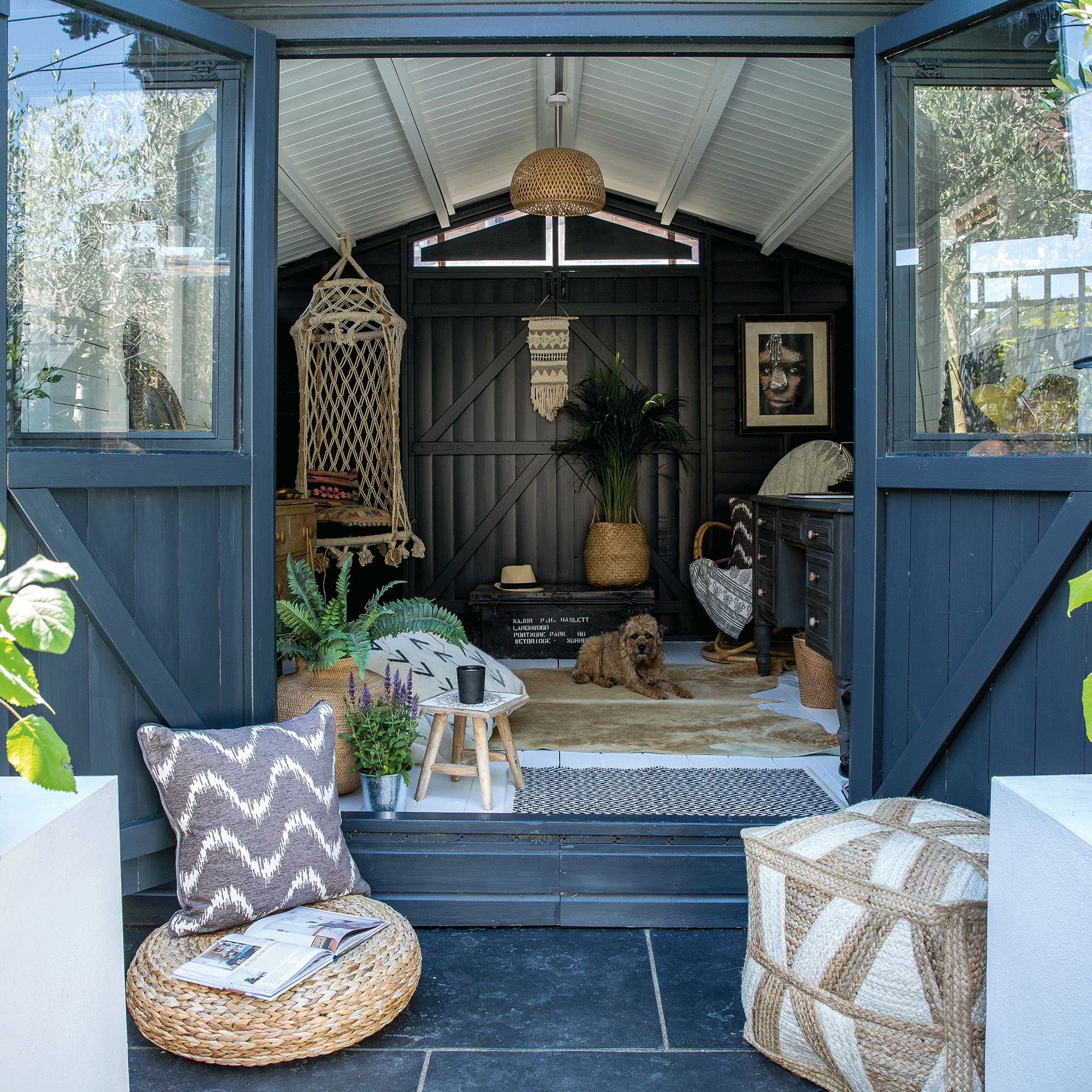 Grey shed with neutral boho interior