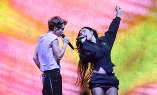 LONDON, ENGLAND - JUNE 27: Charli XCX joins Troye Sivan on stage during the Something to Give Each Other Tour at OVO Arena Wembley on June 27, 2024 in London, England. (Photo by Katja Ogrin/Redferns)