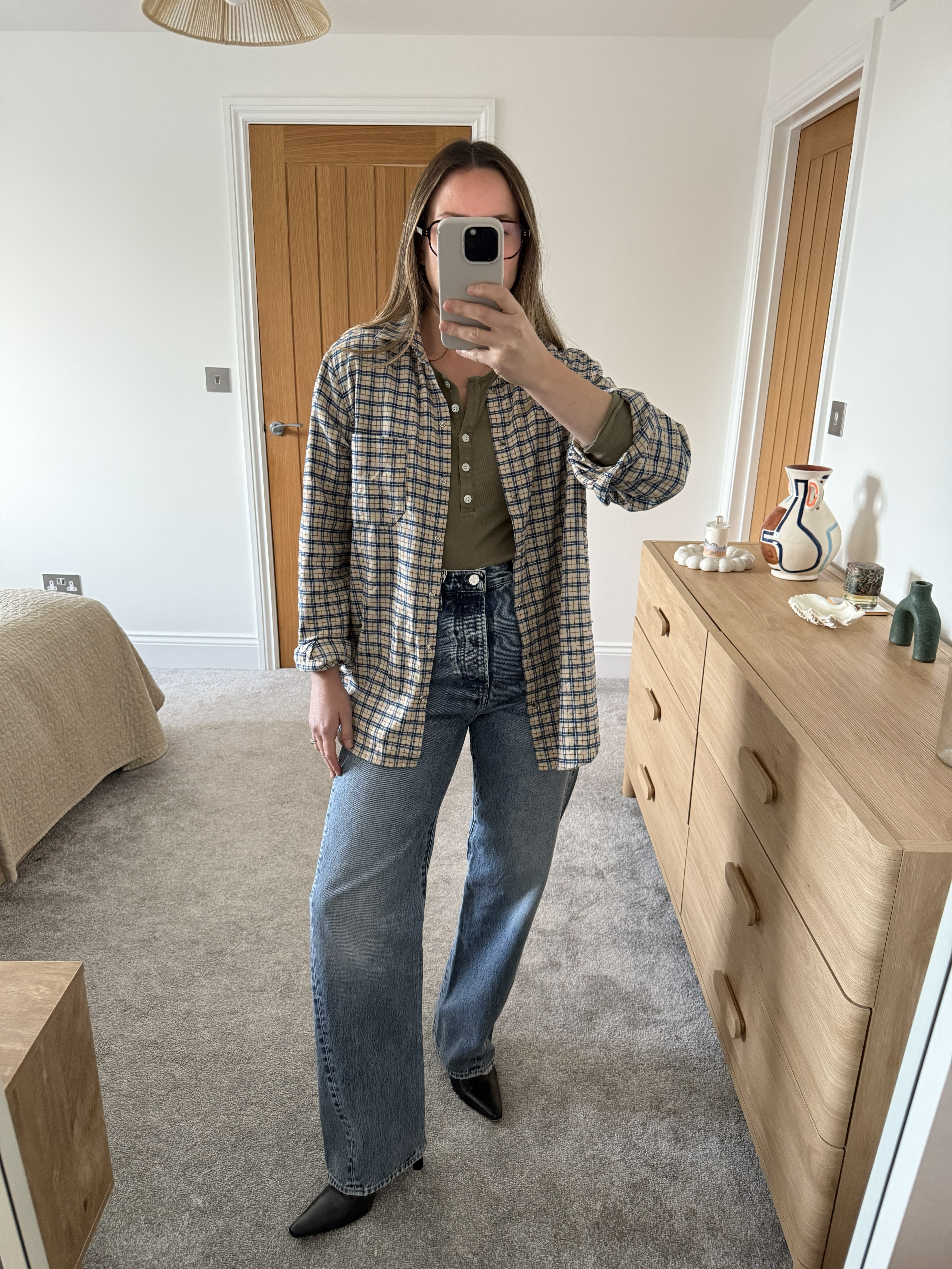 Stylist Emily Dawes wears Toteme's twisted seam jeans