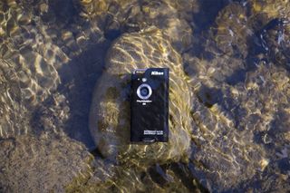 Best camcorders: An image showing a waterproof camcorder submerged in a river