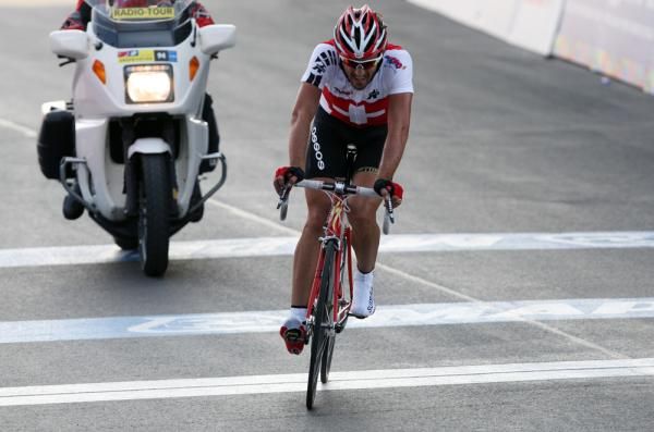 A deflated Fabian Cancellara (Switzerland) crosses the finish.