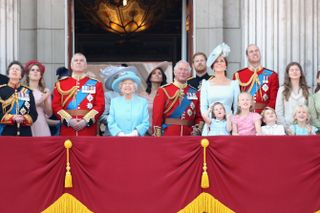 Princess Anne, Princess Royal, Princess Beatrice, Lady Louise Windsor, Prince Andrew, Duke of York, Queen Elizabeth II, Meghan, Duchess of Sussex, Prince Charles, Prince of Wales, Prince Harry, Duke of Sussex, Catherine, Duchess of Cambridge, Prince William, Duke of Cambridge, Princess Charlotte of Cambridge, Savannah Phillips, Prince George of Cambridge and Isla Phillips watch the flypast on the balcony of Buckingham Palace during Trooping The Colour on June 9, 2018 in London, England